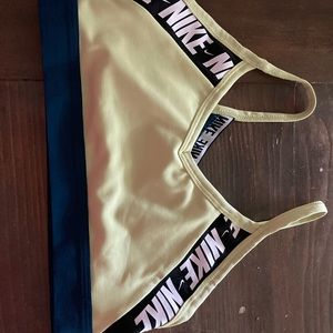 Blue,green,white, and black Nike sports bra